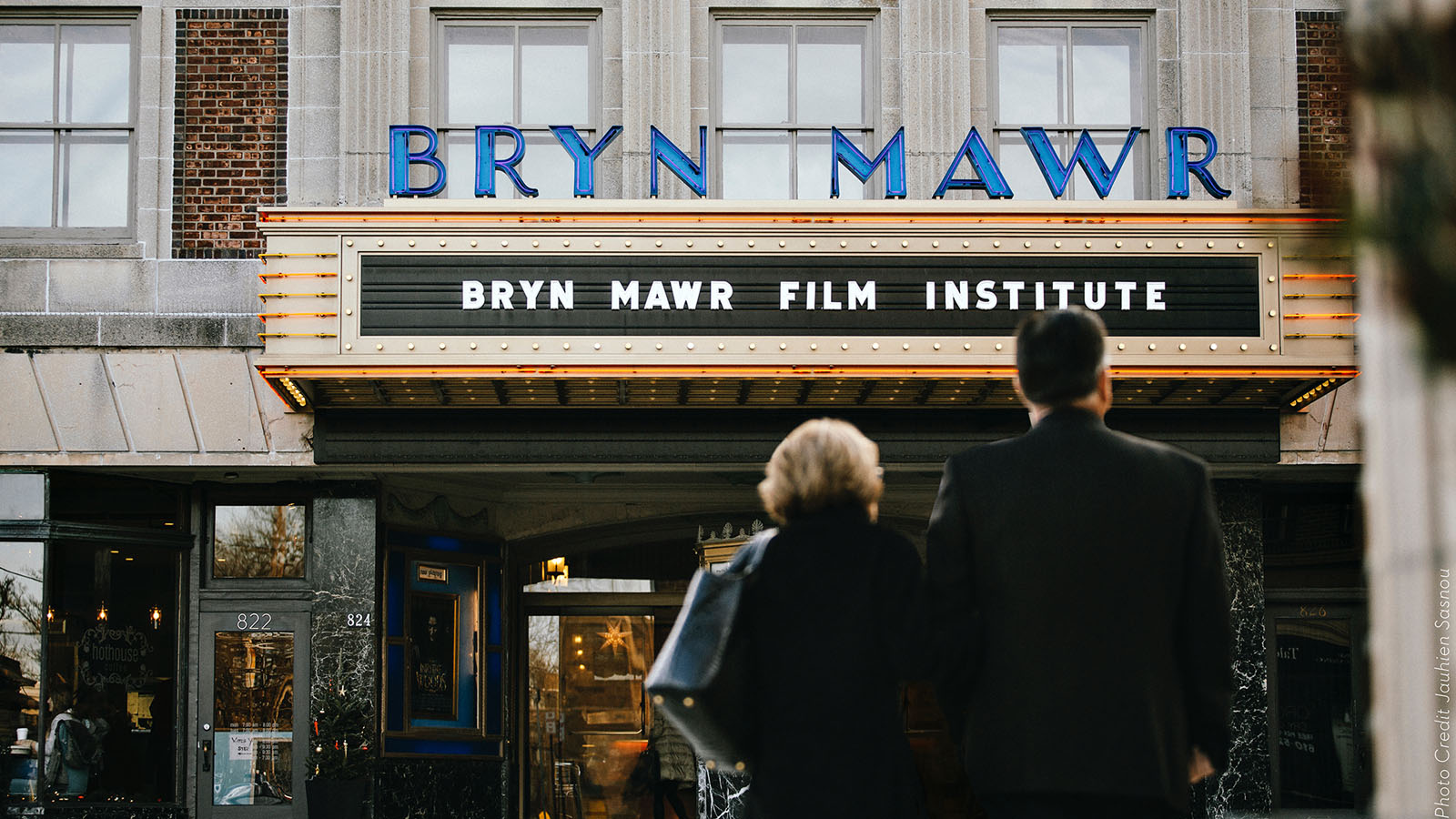 photo of a couple standing in front of BMFI's marquee
